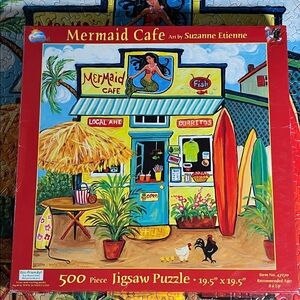 🧩500 piece SunsOut “Mermaid Cafe”. Bright, vivid colors, lots of fun. Complete.
